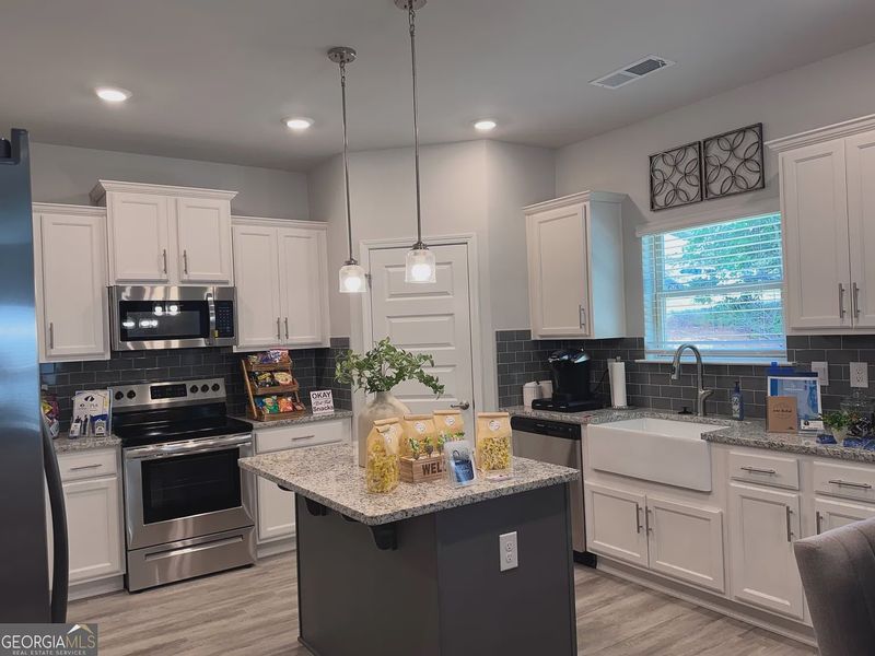 Furnished interior view inside a new home in Magnolia Villas, Cornelia (Image 10).