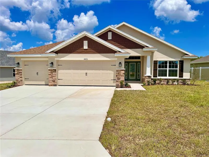 Front exterior of a new home in , Ocala, FL, highlighting curb appeal (Image 1). Front exterior of a new home in , Ocala, FL, highlighting curb appeal (Image 1).