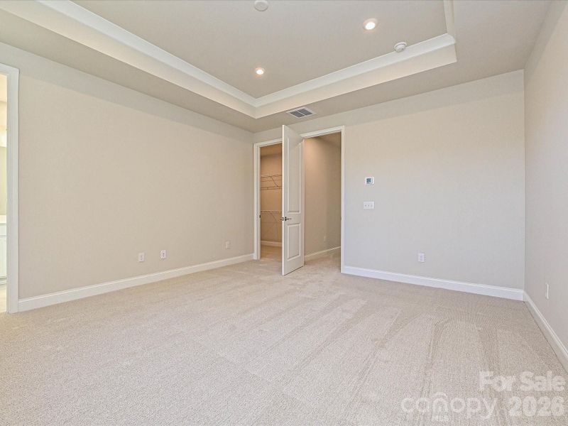 Primary Bedroom with Tray Ceilings Primary Bedroom with Tray Ceilings