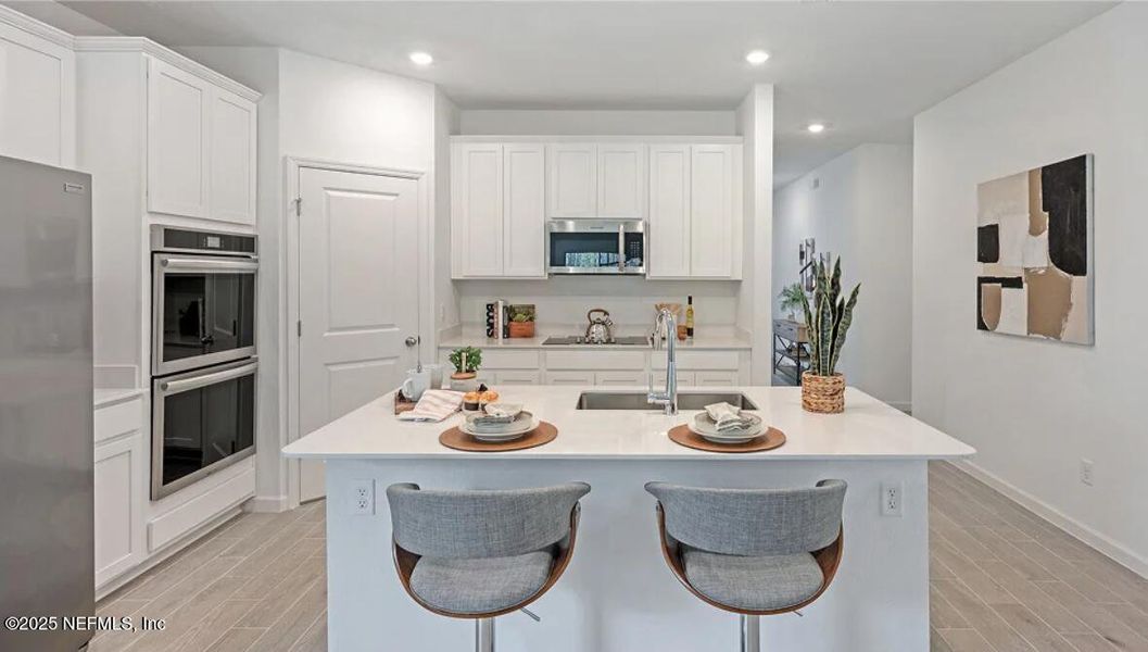 Furnished interior view inside a new home in Edenbrooke at Hyland Trail | 55+: Edenbrooke at Hyland Trail 50s, Green Cove Springs (Image 24).