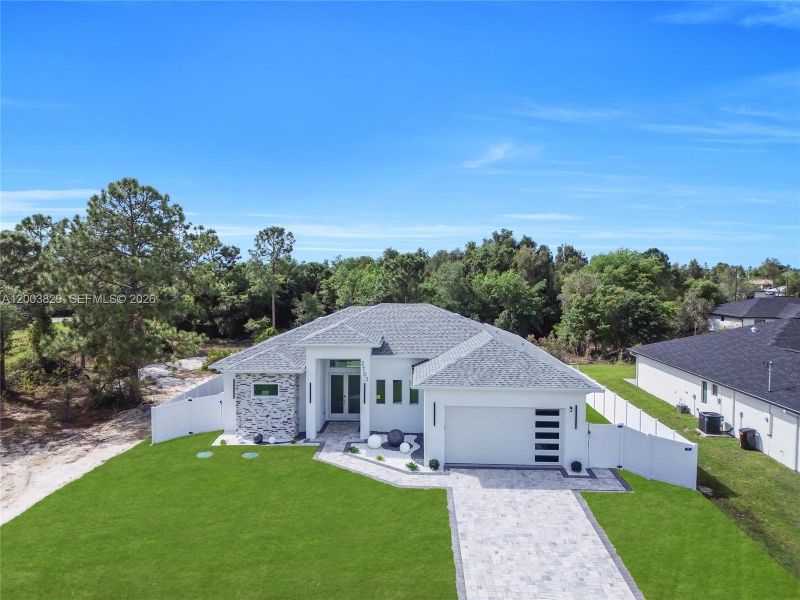 Front exterior of a new home in , Lehigh Acres, FL, highlighting curb appeal (Image 22). Front exterior of a new home in , Lehigh Acres, FL, highlighting curb appeal (Image 22).