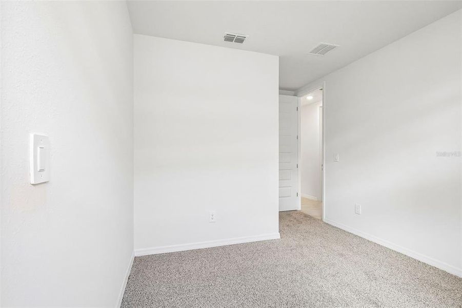 Spacious, unfurnished interior of a new home in The Grove at Stuart Crossing - Signature Series, Bartow (Image 28). Spacious, unfurnished interior of a new home in The Grove at Stuart Crossing - Signature Series, Bartow (Image 28).