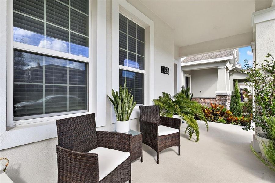 Exterior details and patio area of a home in Storey Park: Innovation Cottage Collection, Orlando (Image 2).
