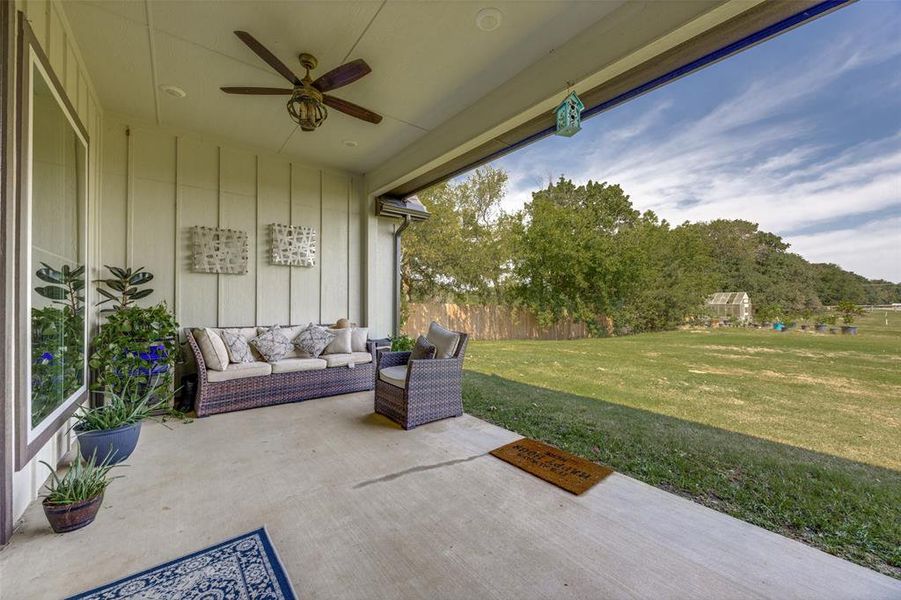 View of patio featuring ceiling fan and an outdoor hangout area