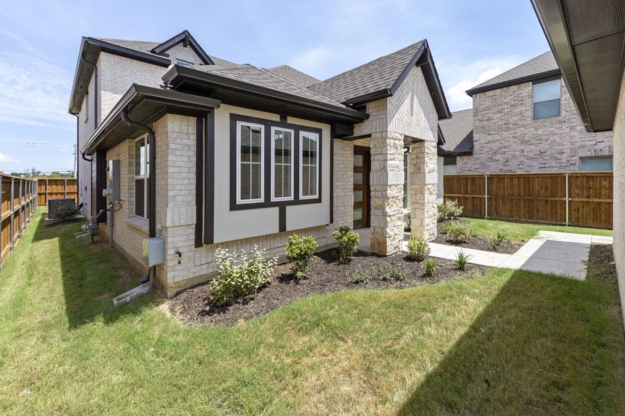 Exterior details and patio area of a home in The Reserve at Spiritas Ranch, Little Elm (Image 3).