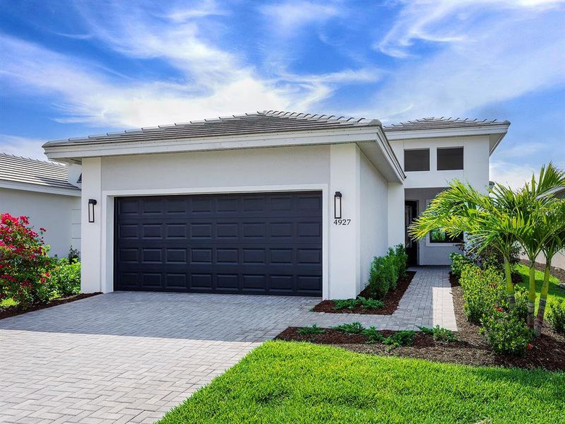 Front exterior of a new home in , Bradenton, FL, highlighting curb appeal (Image 18).