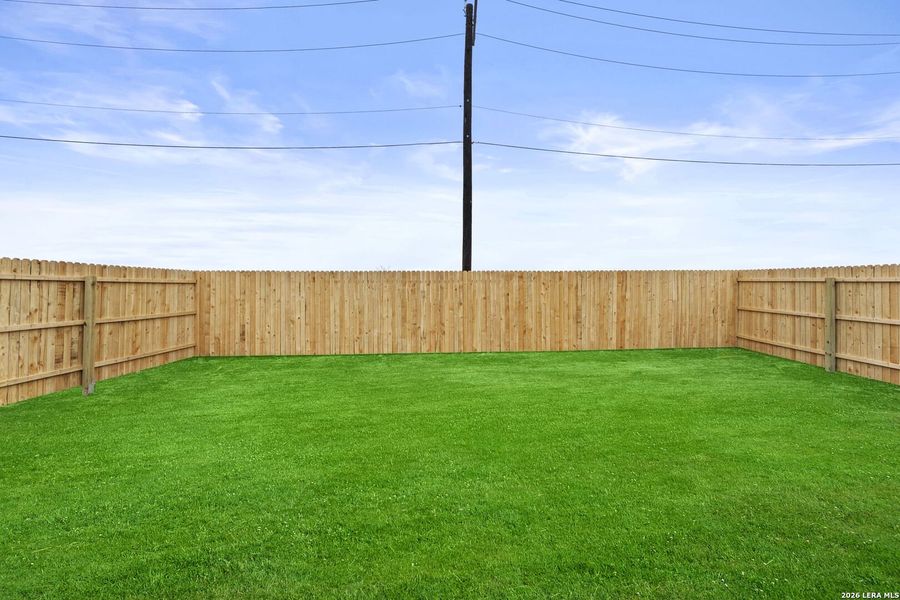Exterior details and patio area of a home in Randolph Crossing, Converse (Image 2).