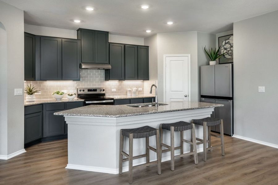 Representative furnished interior of a home built from the 1702 Modeled by KB Home in Stoney Chase, Del Valle (Image 6).
