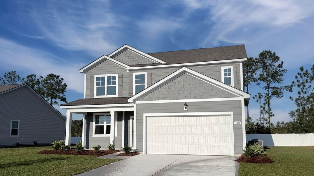 Front exterior of a new home in Auberon Woods, Conway, SC, highlighting curb appeal (Image 2). Front exterior of a new home in Auberon Woods, Conway, SC, highlighting curb appeal (Image 2).