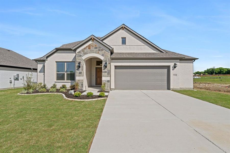 Front exterior of a new home in , Venus, TX, highlighting curb appeal (Image 19).