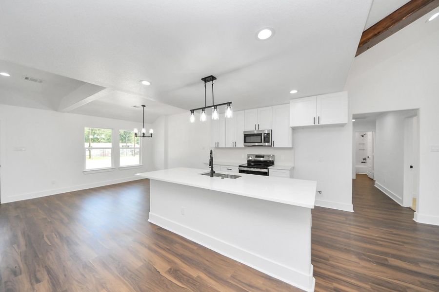 Island double as prep space and serving station for gathering with easy access.