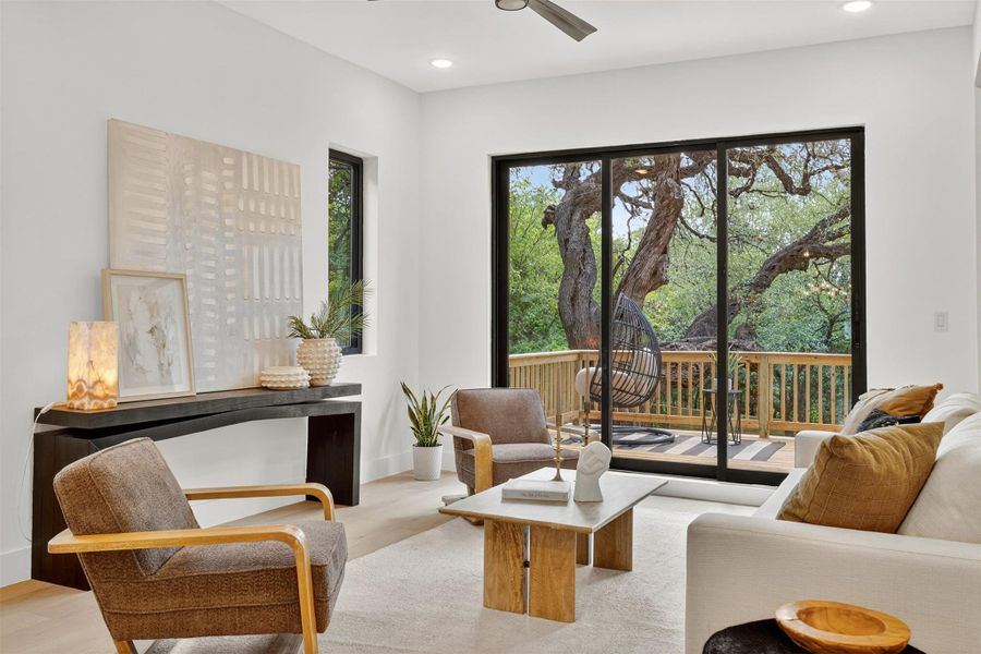 Through the sliding glass doors, the living room frames your backyard oasis, blending indoor comfort with outdoor tranquility and turning every glance into a moment of calm inspiration Through the sliding glass doors, the living room frames your backyard oasis, blending indoor comfort with outdoor tranquility and turning every glance into a moment of calm inspiration