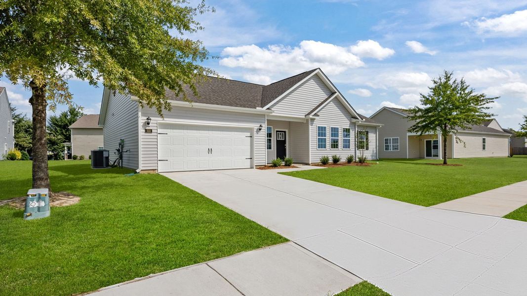 Front exterior of a new home in Tyler - Home on the Lake, New Bern, NC, highlighting curb appeal (Image 2).