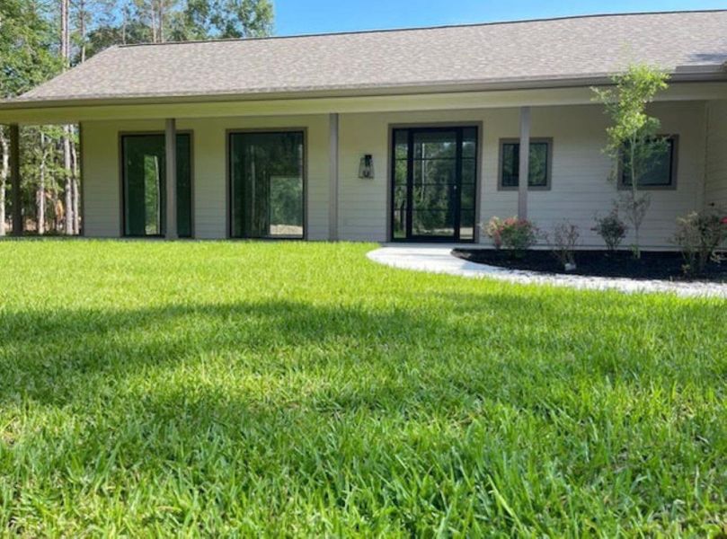 Exterior details and patio area of a home in , Conroe (Image 21).