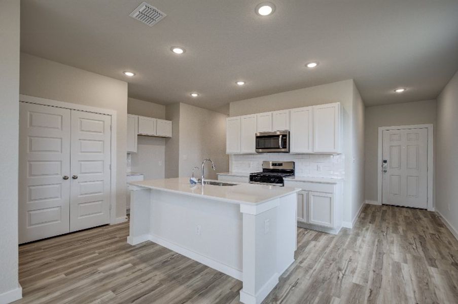 A kitchen with white cabinets. A kitchen with white cabinets.