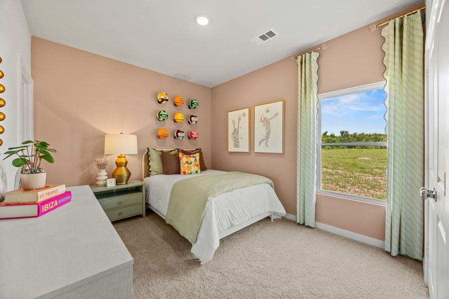 A bedroom with a bed and a window. A bedroom with a bed and a window.