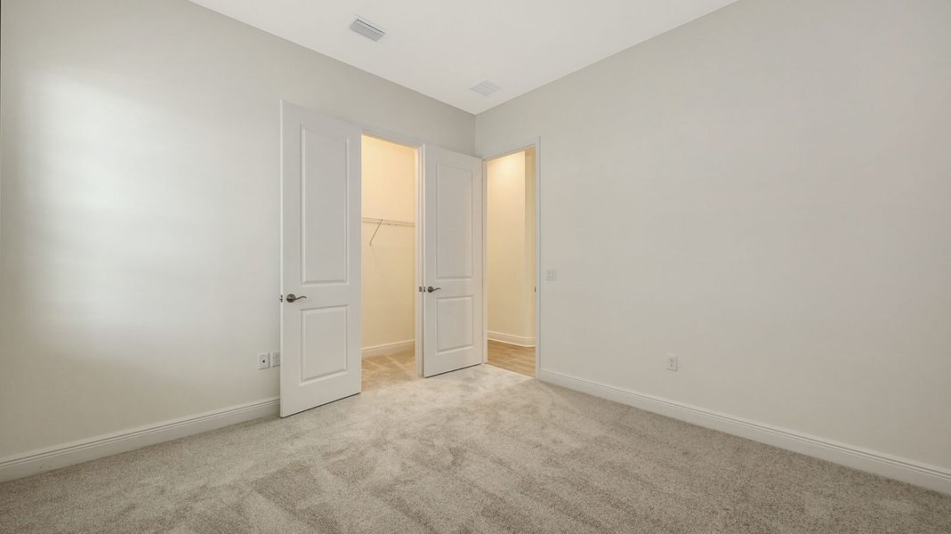Spacious, unfurnished interior of a new home in Wildleaf at North River Ranch, Parrish (Image 32).
