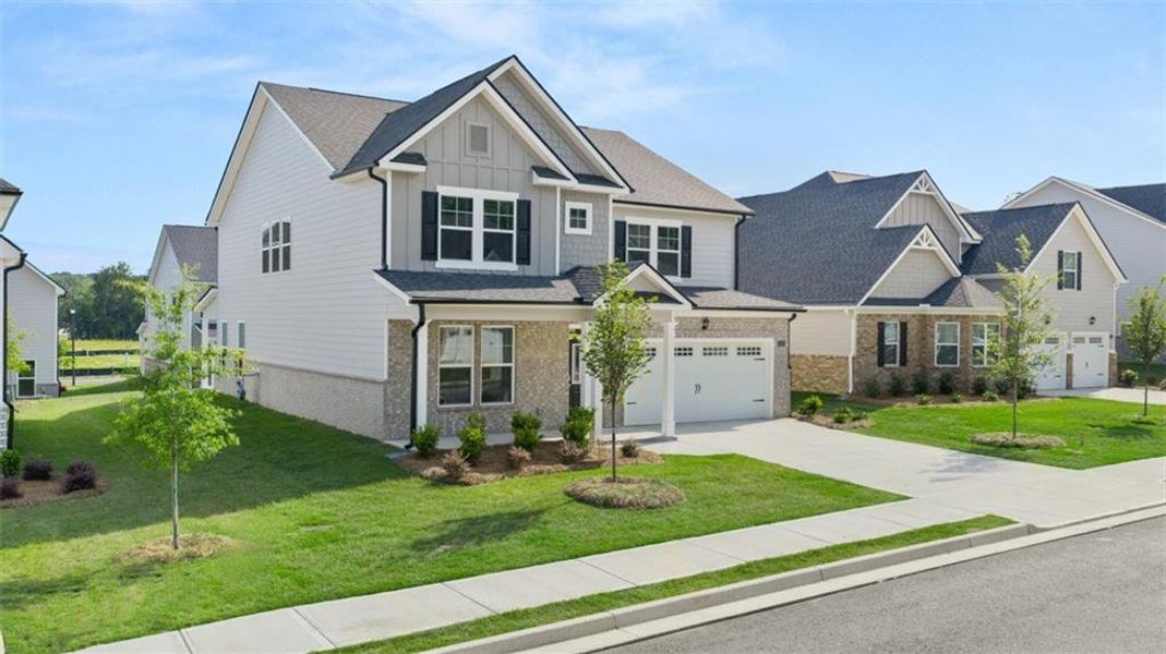 Front exterior of a new home in Wildwood, Covington, GA, highlighting curb appeal (Image 25).