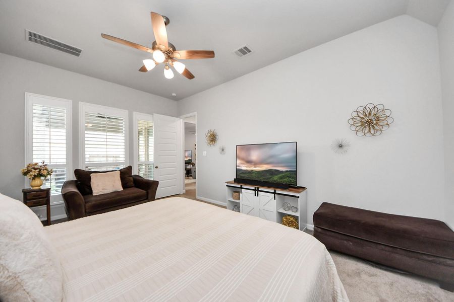 Primary bedroom offers plenty of space for sitting area.