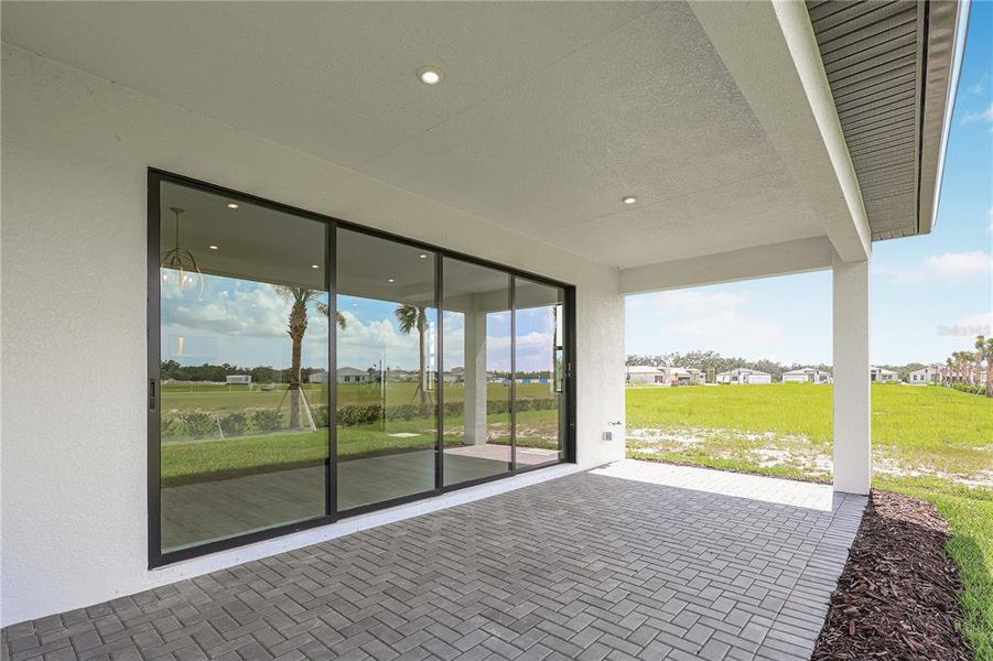 Exterior details and patio area of a home in Woodland Preserve, Parrish (Image 27).