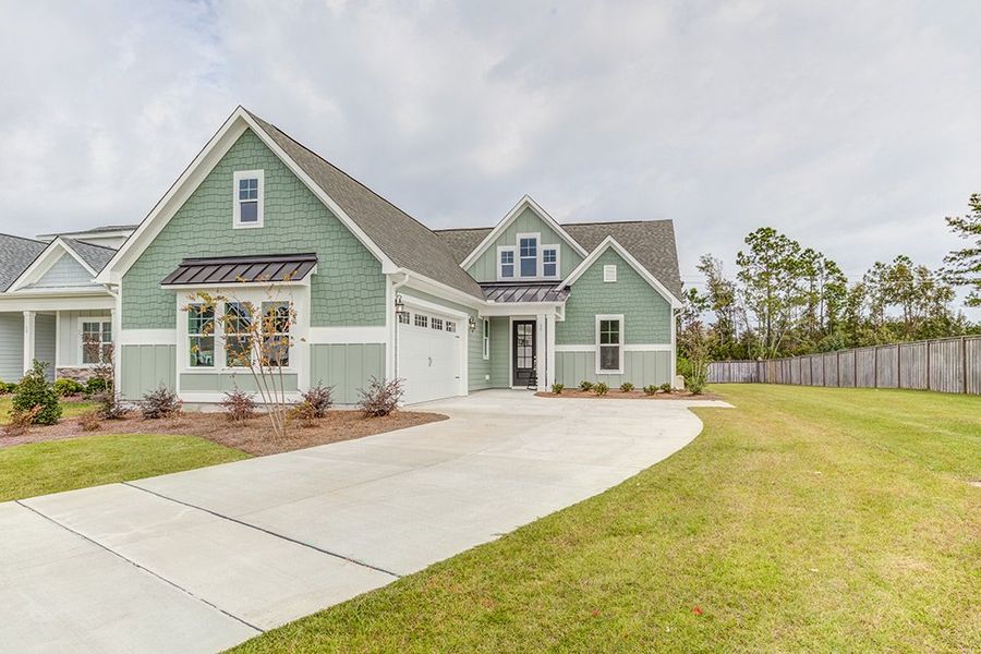 Representative exterior photo of a completed home built from the The Amherst by RobuckHomes in Windwater, Hampstead, NC (Image 25).