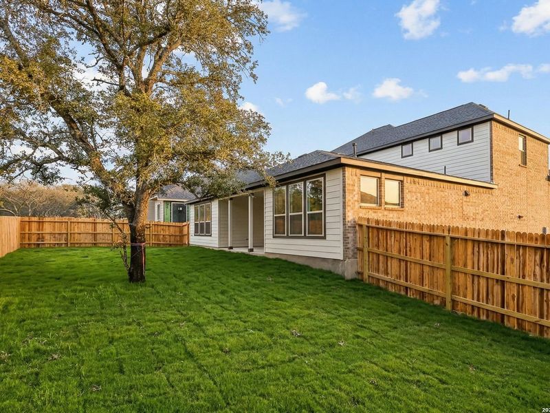 Exterior details and patio area of a home in The Reserve at Potranco Oaks, Castroville (Image 4).