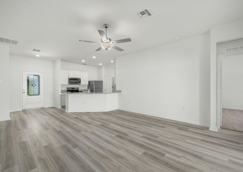 Spacious entertainment space with vinyl flooring