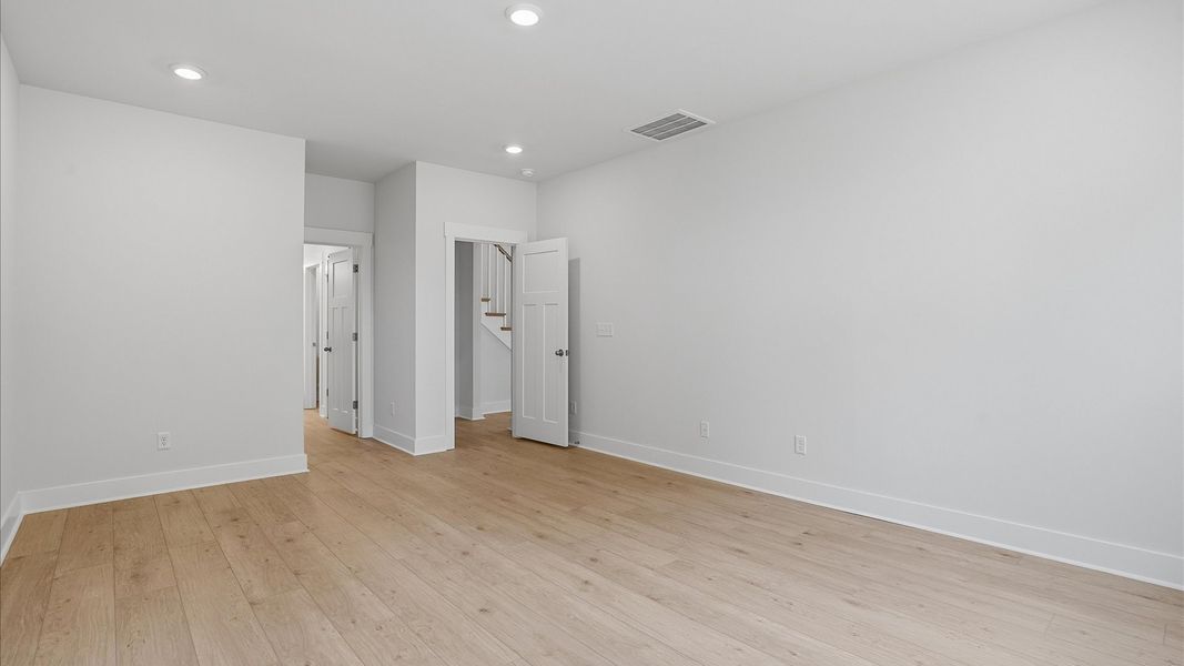 First-class hardwood floors and tasteful finishes elevate the private retreat of this exceptional primary suite