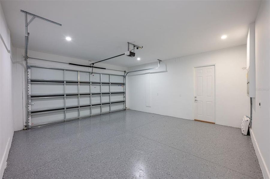 two car garage that includes outlet for electric cars