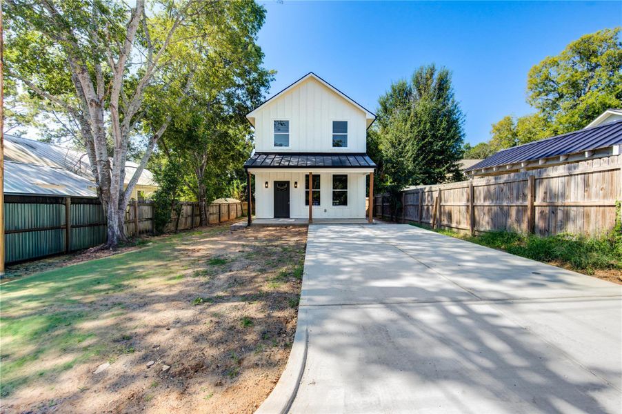 Front exterior of a new home in , Bellville, TX, highlighting curb appeal (Image 1).