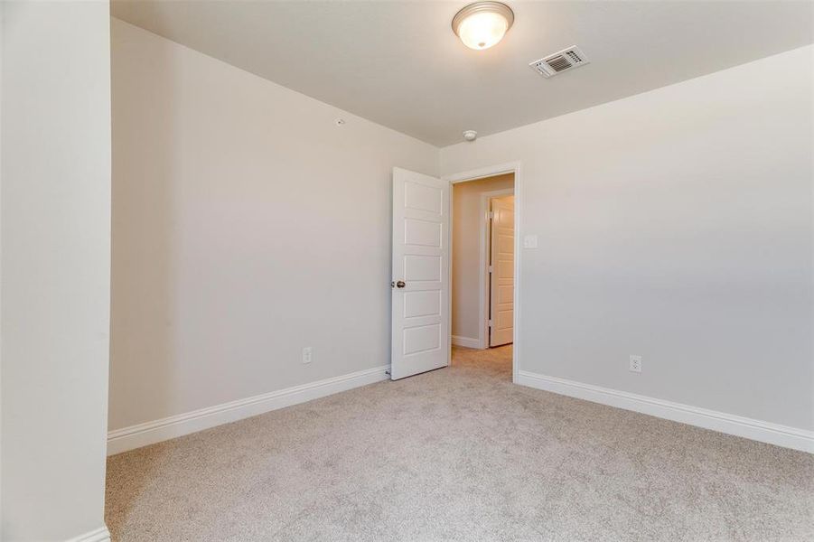 Spare room with light carpet