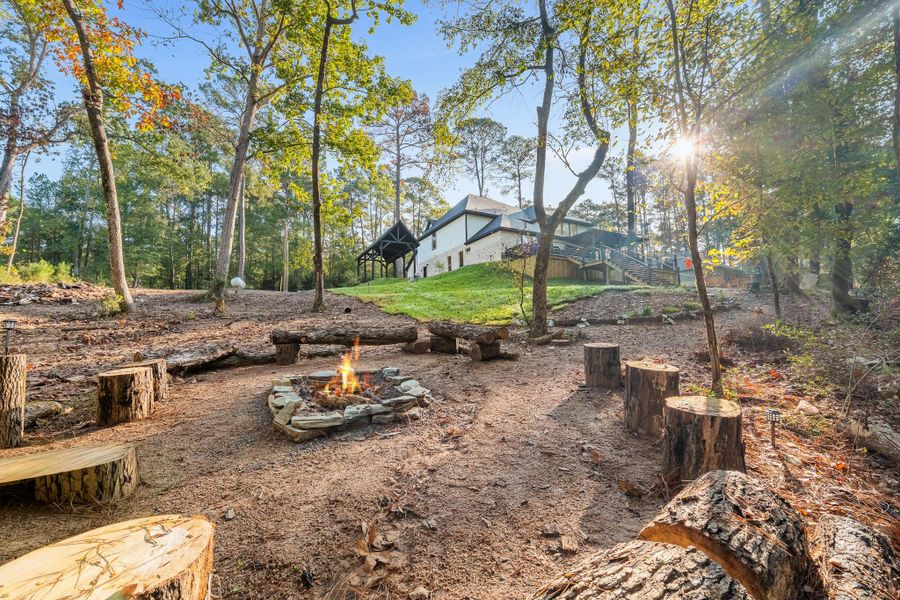 The view from the firepit area towards the house. The view from the firepit area towards the house.