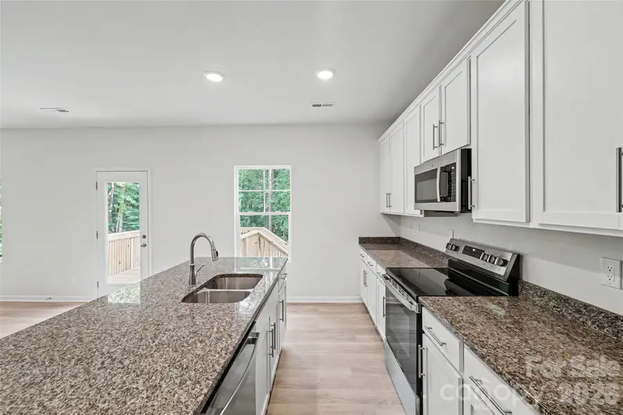 Furnished interior view inside a new home in , Iron Station (Image 10).