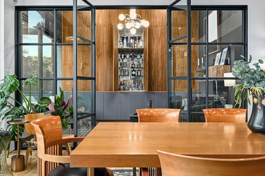Flex space offers a secondary living area with built in bar.