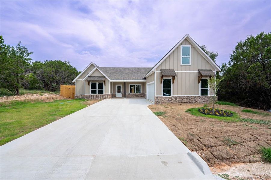 View of front of house featuring a front lawn