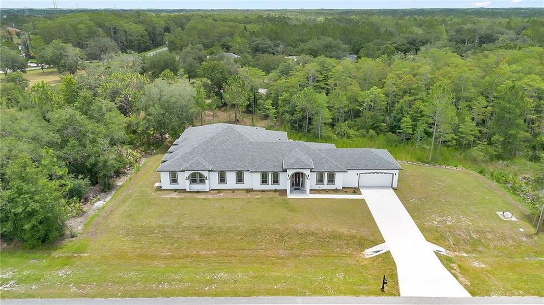Front exterior of a new home in , Orlando, FL, highlighting curb appeal (Image 1). Front exterior of a new home in , Orlando, FL, highlighting curb appeal (Image 1).