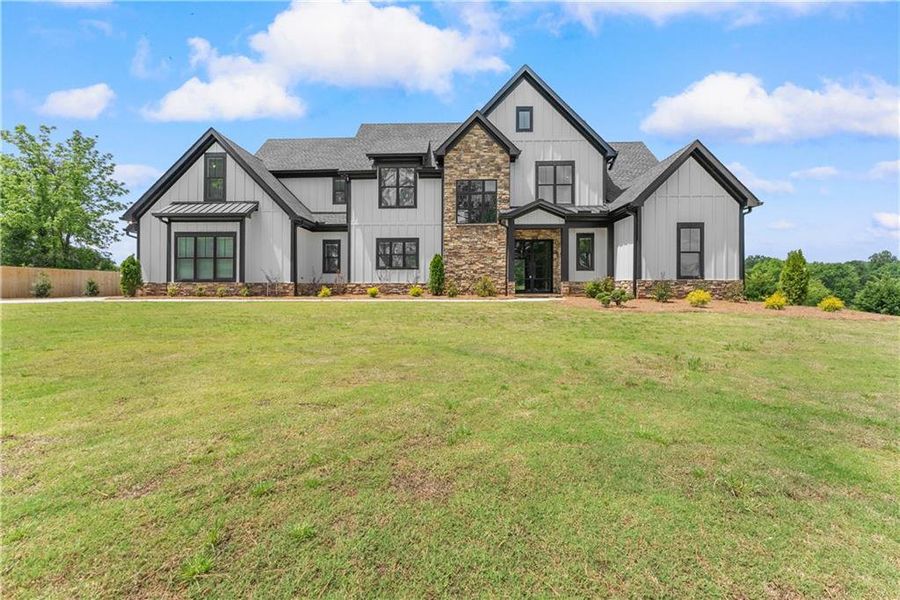 Front exterior of a new home in , Cumming, GA, highlighting curb appeal (Image 2). Front exterior of a new home in , Cumming, GA, highlighting curb appeal (Image 2).
