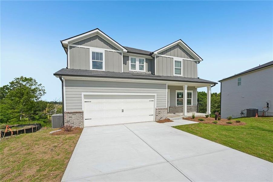 Front exterior of a new home in Ivey Township, Dallas, GA, highlighting curb appeal (Image 27).