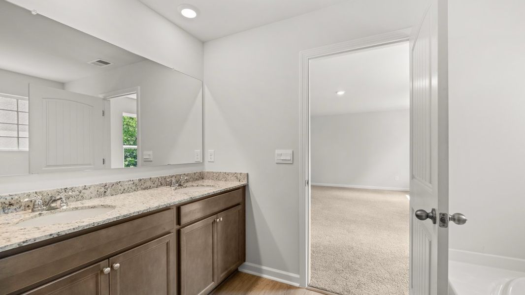 Representative furnished interior of a home built from the Hanover by D.R. Horton in Northwoods at Mirror Lake, Villa Rica (Image 13).