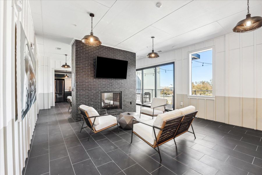 A stylish, contemporary living area boasts a modern fireplace and seamless outdoor access. A stylish, contemporary living area boasts a modern fireplace and seamless outdoor access.