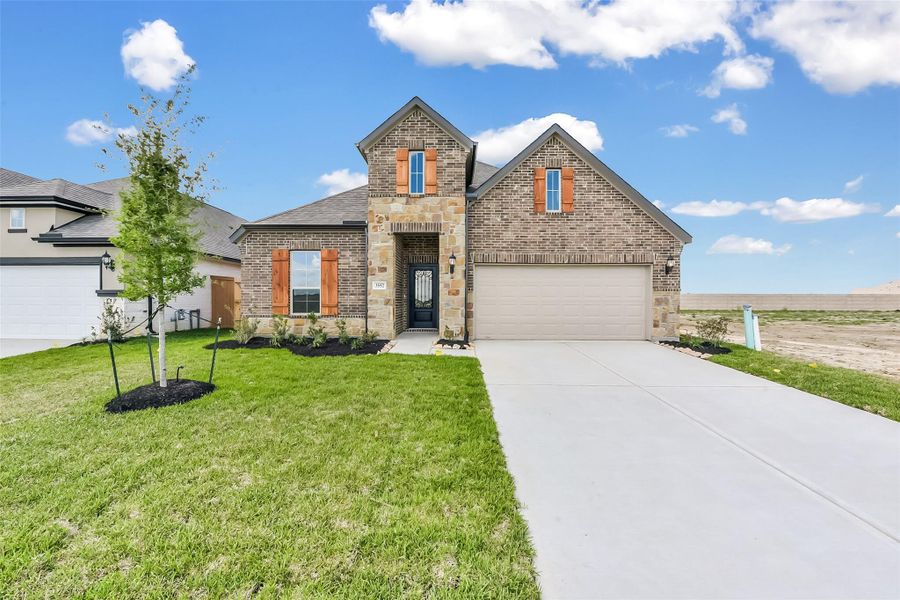 Front exterior of a new home in River Ranch Meadows, Dayton, TX, highlighting curb appeal (Image 24).