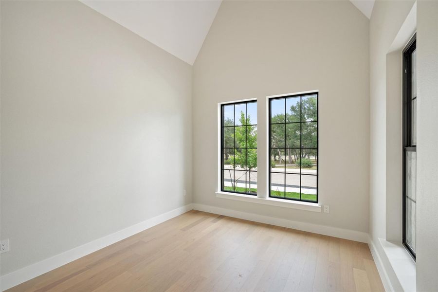 Voluminous vaulted ceilings and elegant hardwood flooring define this versatile interior space. Voluminous vaulted ceilings and elegant hardwood flooring define this versatile interior space.