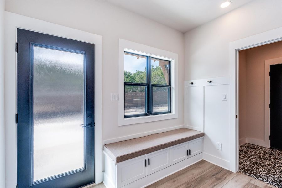 Mudroom with light wood-style flooring