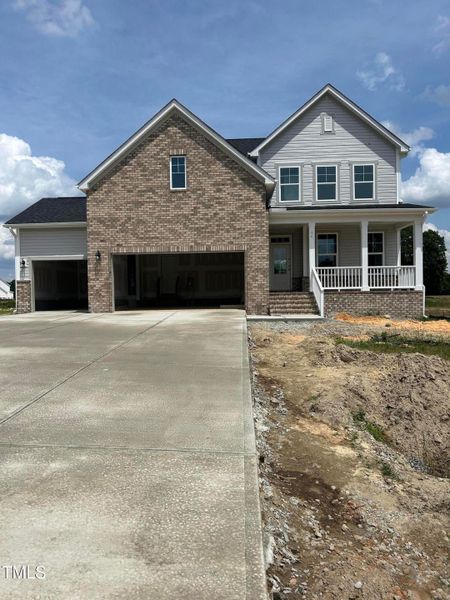Front exterior of a new home in Tobacco Road, Angier, NC, highlighting curb appeal (Image 69). Front exterior of a new home in Tobacco Road, Angier, NC, highlighting curb appeal (Image 69).