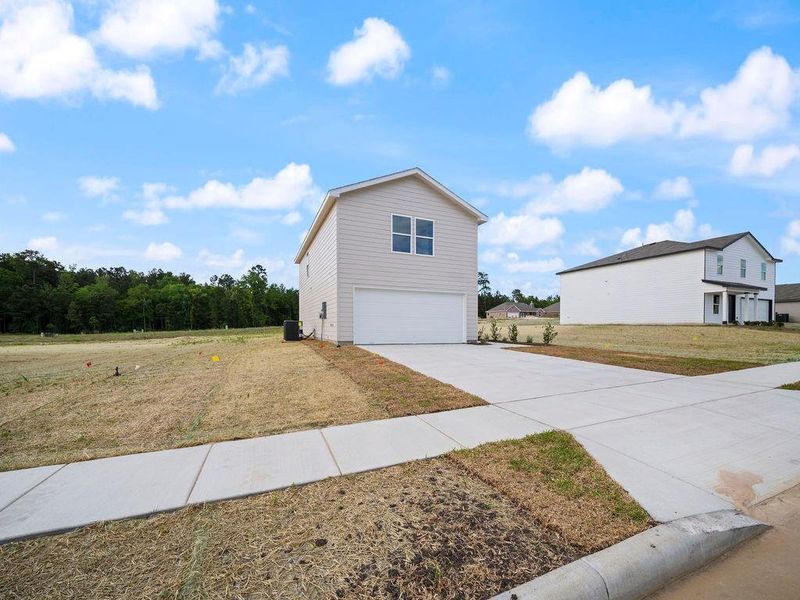 Front exterior of a new home in Stoney Ridge, Hudson, TX, highlighting curb appeal (Image 17).