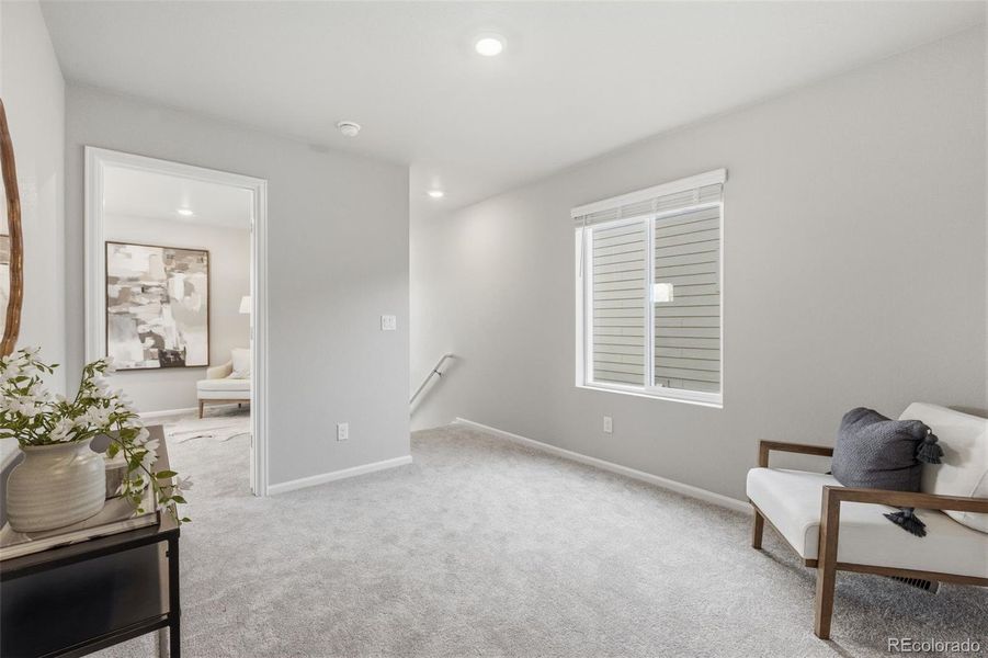 Furnished interior view inside a new home in Woodrose at Painted Prairie, Aurora (Image 18).