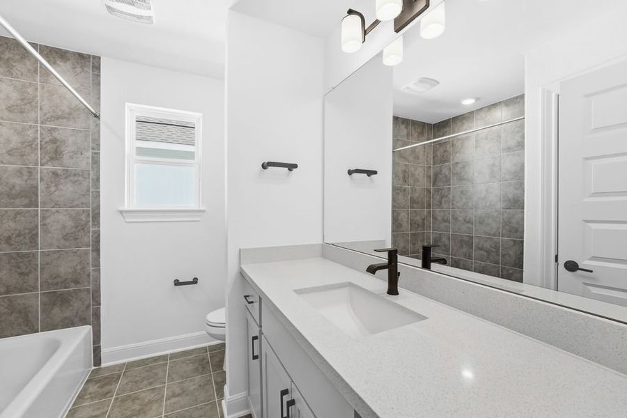 Furnished interior view inside a new home in Travisso, Leander (Image 9).