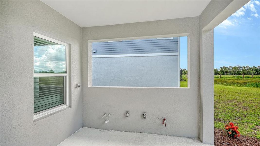 Exterior details and patio area of a home in Grand Park, Sarasota (Image 23).