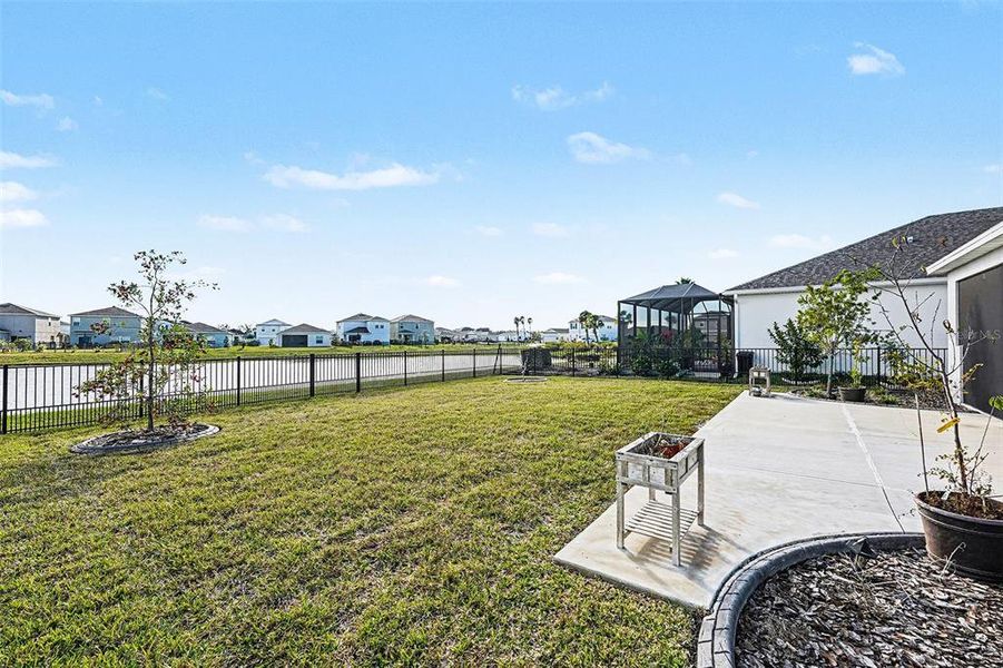 Exterior details and patio area of a home in Eave's Bend at Artisan Lakes, Palmetto (Image 19).