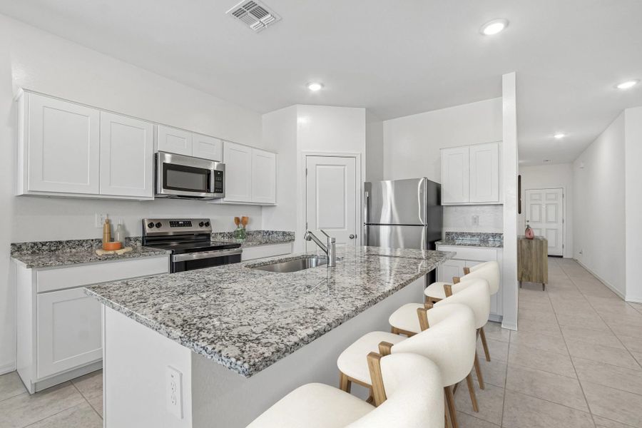 Representative furnished interior of a home built from the Moonbeam by Starlight Homes in Hawks Run, Kissimmee (Image 5).